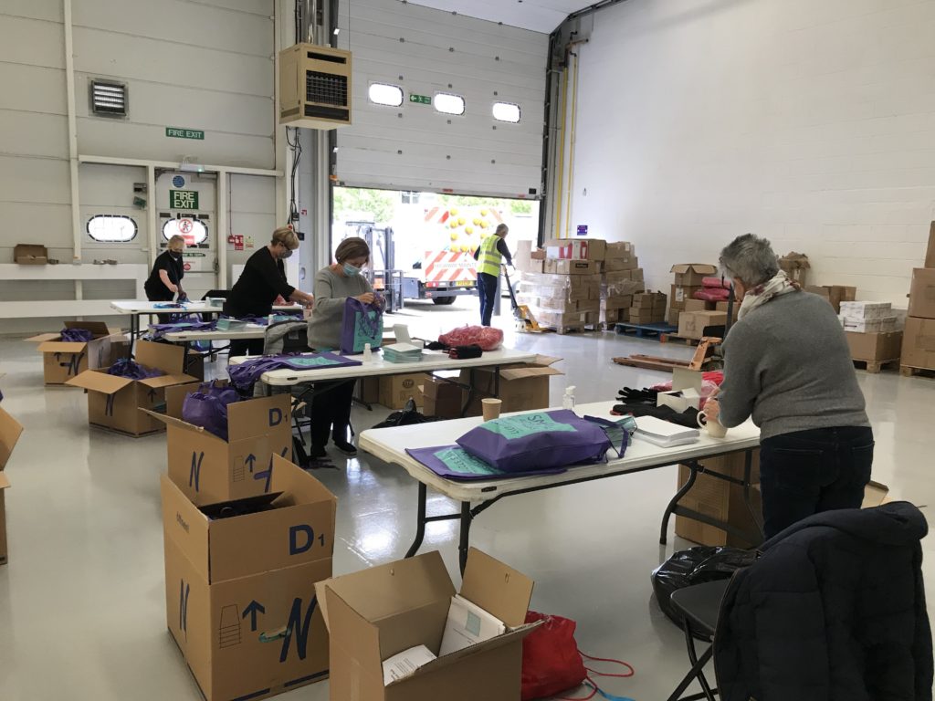 people packing gift bags