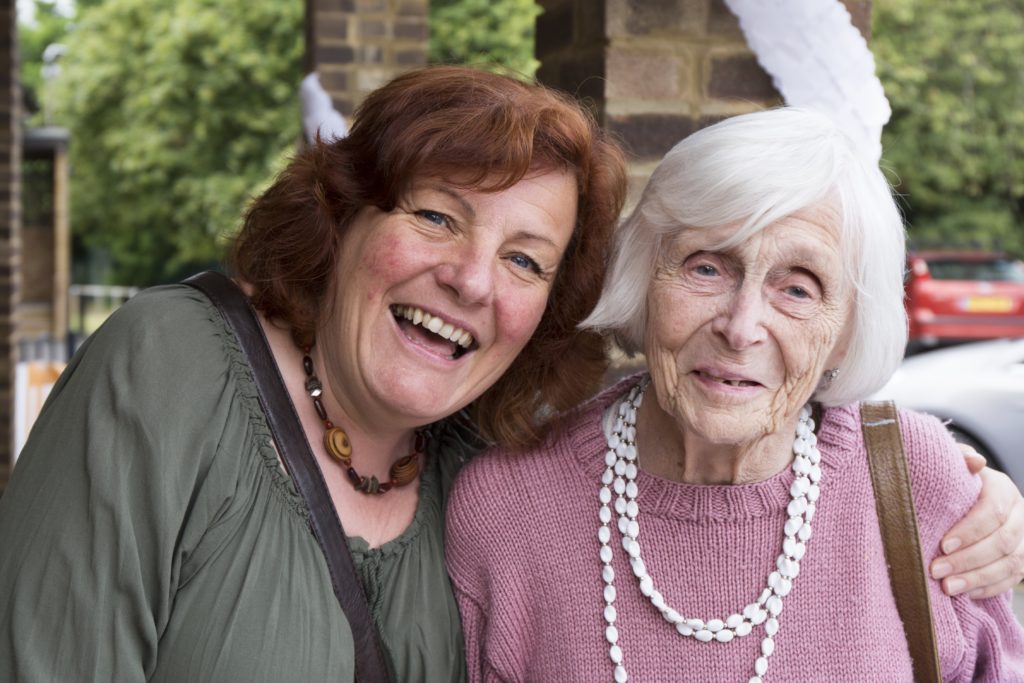 Two ladies smiling for a photo