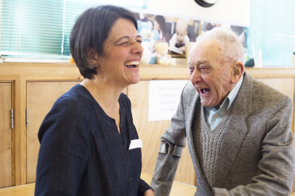 Two people laughing