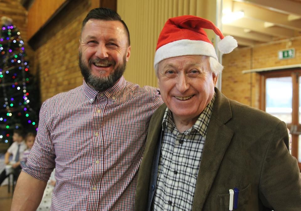 Two men smiling for a photo