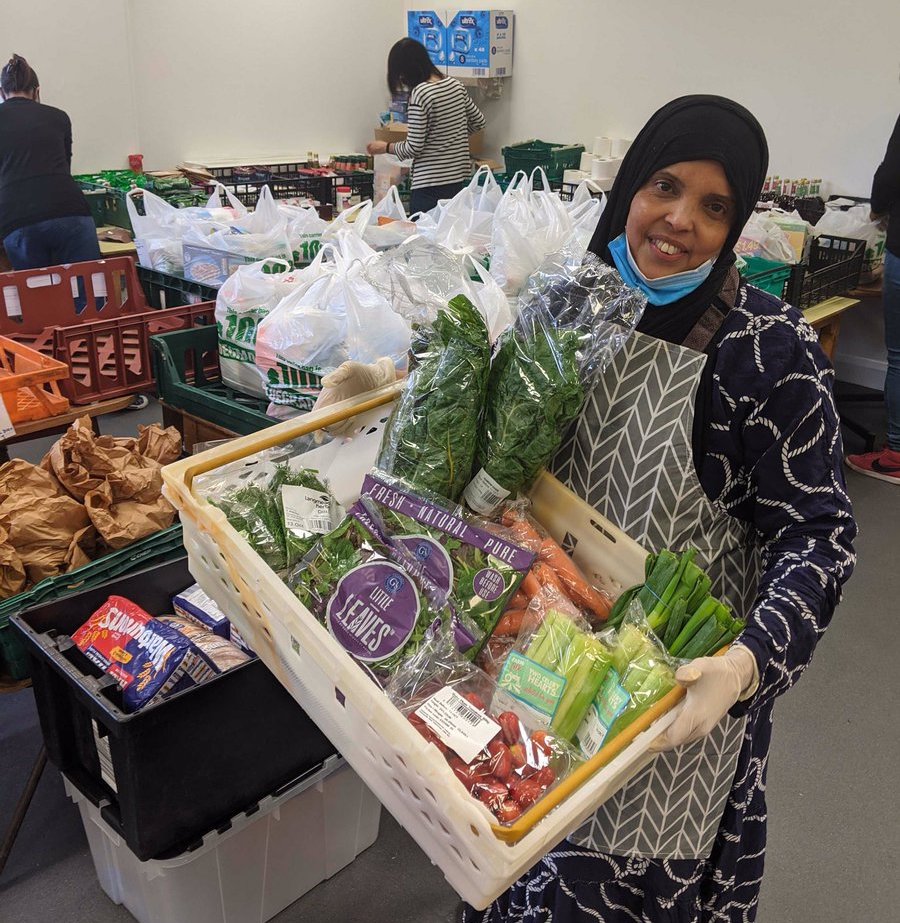 Woman holding a tray of vegetables